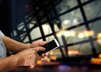 High tech old man hands use smartphone , elder lifestyle with window airport abstract background , copyspace area