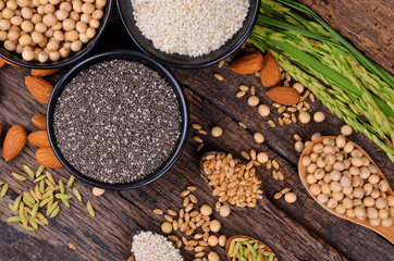 Fototapeta na wymiar Cereal grains , seeds, beans on wooden background.