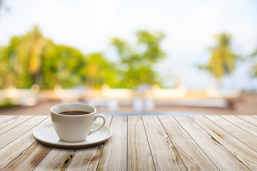 Cup of coffee on wooden table