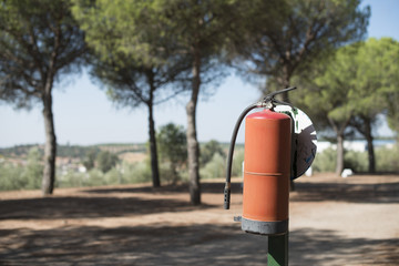 Fire extinguisher in the woods