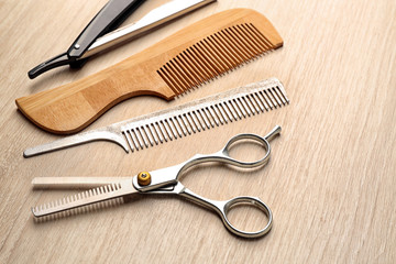 Vintage tools of barber shop on wooden background