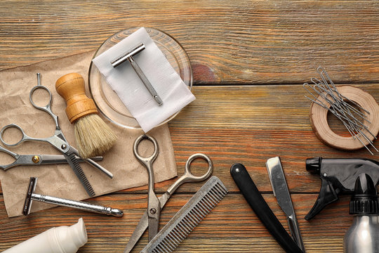 Vintage tools of barber shop on wooden background