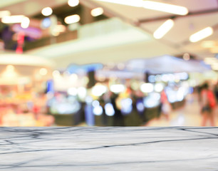Empty white marble table with blur cafe background.