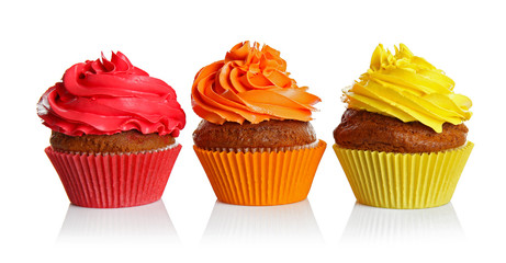 Fresh tasty cupcakes isolated on white
