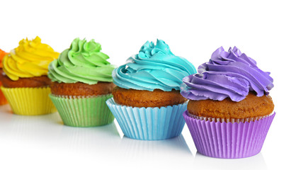 Fresh tasty cupcakes isolated on white