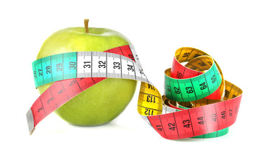 Fresh apple with measuring tape on white background