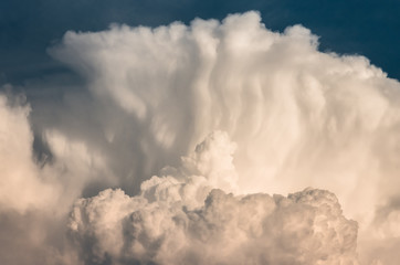 Fototapeta na wymiar large cumulus storm clouds in the blue sky