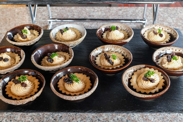 Appetizer pie tuna cream in cup on stone table