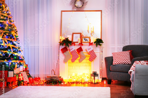 &quot;Beautiful fireplace in living room decorated for Christmas&quot; Stock