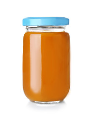 Glass jar of baby puree on white background