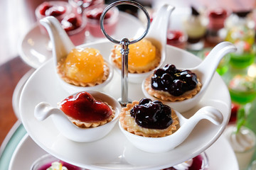 different berries cheeze pie in spoon for party