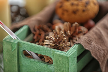 Green box with Christmas decoration, closeup