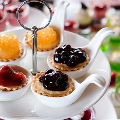 different berries cheeze pie in spoon for party