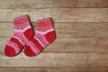 Obraz na płótnie Canvas Winter socks on wooden background