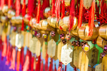 Golden bell at Wong Tai Sin Temple people wish and hang it on ro - obrazy, fototapety, plakaty