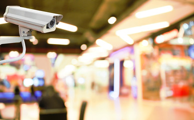 CCTV Camera on abstract blur beautiful luxury shopping mall for background.