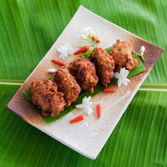 Fried  minced pork  ball on plate and banana leaf