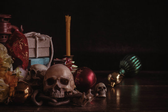 Skull and gifts on wooden.