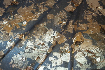 Gold leaf on surface statue