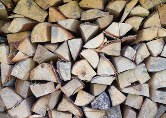 Fototapeta premium Background of dry chopped firewood logs