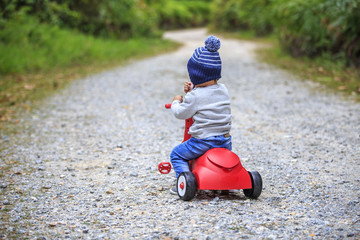 kid on a bicycle in nature