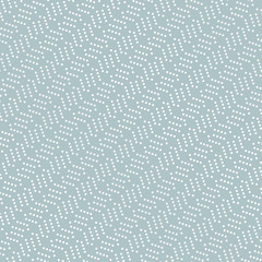 Geometric ornament with dotted elements. Seamless abstract background. Light blue and white pattern