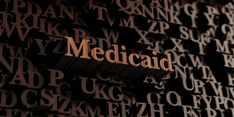 Medicaid - Wooden 3D rendered letters/message.  Can be used for an online banner ad or a print postcard.