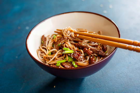 Asian soba noodles with beef and sesame