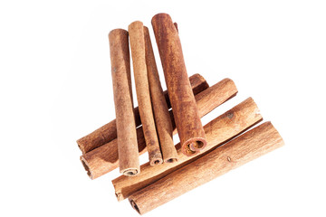 Cinnamon sticks isolated on white background, close up.