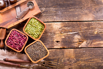 various dried beans with kitchen utensils