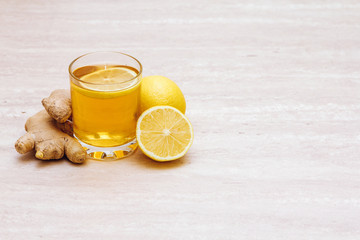 Cup of ginger tea with lemon. Copyspace