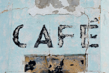 Faded painted cafe sign