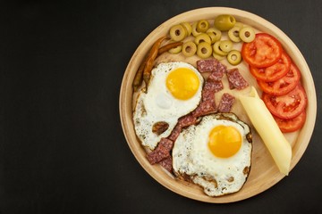 Fried Eggs on a plate. A hearty breakfast for athletes. Healthy food.
