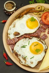 Fried Eggs on a plate. A hearty breakfast for athletes. Healthy food.
