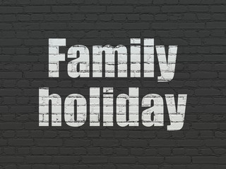 Tourism concept: Family Holiday on wall background