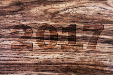 Background New 2017 Year with numbers on wooden background