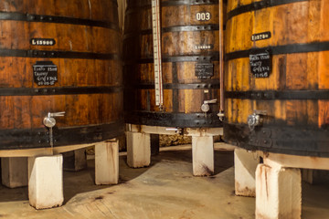 Port tawny wine wooden barrel mature aging alcohol cellar interior Vila Nova de Gaia Porto Oporto