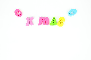 Colorful letters "X MAS". White background.