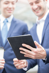 businesspeople walk on road