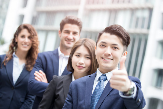  businessman smiles show thumb up