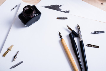 Paper, ink and calligraphy pens. Lettering workshop details