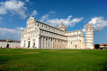 Naklejka premium The Cathedral of Pisa and the Pisa Tower in Pisa, Italy. The leaning tower of Pisa is one of the most famous tourist destinations in the world which is located in Pisa town in north Italy.