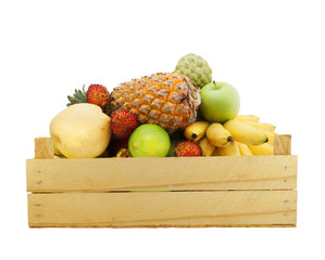 Fresh fruits in wooden box isolated on white background