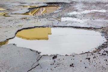 water damaged by potholes in the road