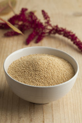  Bowl with amaranth seeds and a twig with flowers