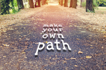 Make your own path. Motivational quote to create future on nature background. - obrazy, fototapety, plakaty