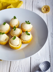 Lemon icecream served in half of lemon