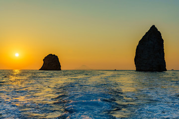 Fototapeta na wymiar lonely rocks in sea between lipari and volcano, Sicily