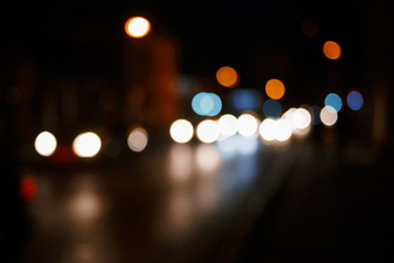 City night background. Defocused car lights in a street abstract road travel blurry scene. A lot of place for text