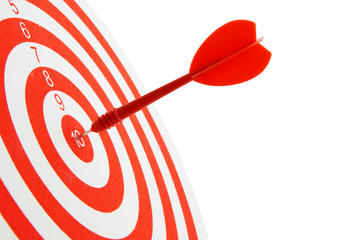 Red and white shooting target and arrow isolated on white